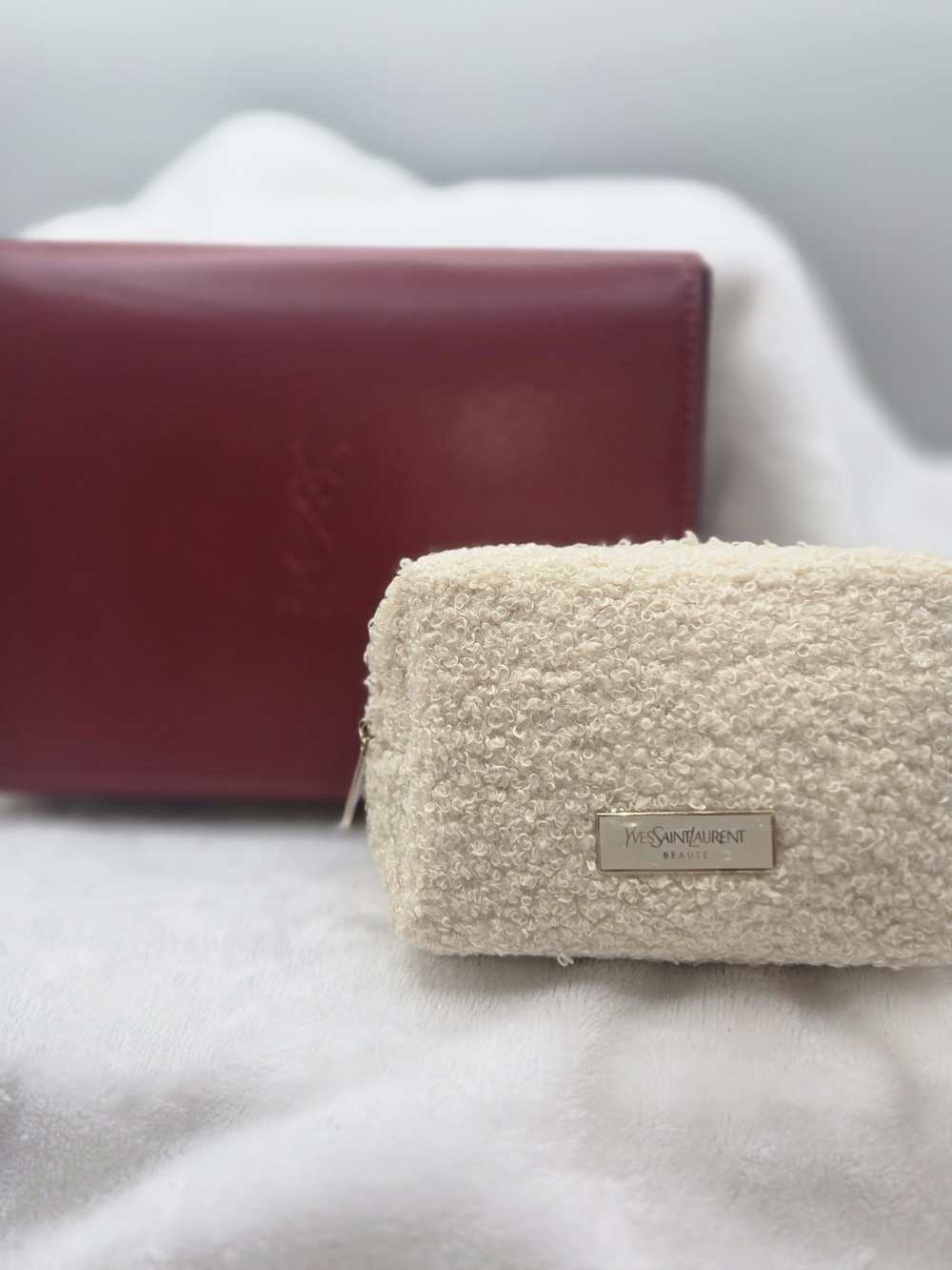 Yves Saint Laurent Beauté red fold-over clutch bag paired w Cream Pouch